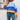 Women's oversized pastel striped knit sweater featuring a cozy aqua and purple design, worn by a person pairing it with jeans. The sweater has a loose fit with long sleeves and a comfortable, casual style.