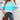 Women's oversized pastel striped knit sweater featuring aqua and purple colors, modeled with jeans.