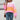 Women's oversized pastel striped knit sweater in aqua and purple, featuring long sleeves and a cozy pullover design.