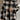 Women's oversized plaid fleece shacket featuring a monogram "M" design, combining black and white tartan patterns with long sleeves, a cozy winter style.