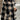 Women's oversized plaid fleece shacket in a cozy winter style with a monogram "M," featuring a black, white, and grey tartan pattern.