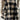 Women's oversized plaid fleece shacket with a monogram M, featuring a cozy winter style. The shacket displays a tartan pattern in black and white tones, perfect for a casual and stylish look.