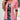 Woman wearing a pink cardigan over a floral blouse, paired with jeans, smiling and posing casually.