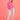 Women's pink heart cardigan in fuzzy knitwear worn by a model with long hair and glasses, paired with jeans and shoes, showcasing a trendy statement sweater.