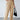 Women's plush brown fleece lounge pants with a cozy wide-leg design, captured in a relaxed positioning, highlighting the waist and thigh areas. The soft beige fabric is showcased, emphasizing comfort and style.