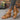 Women's chic black rhinestone wedge sandals worn by a model, showcasing the summer fashion footwear with a stylish and elegant design.