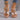 Women's chic black rhinestone wedge sandals on feet, showcasing a stylish summer fashion look.