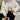 White women's ribbed high collar insulated puffer jacket featuring long sleeves and a fitted waist.