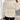 Women's ribbed high collar white insulated puffer jacket showcasing its design with a high neck, long sleeves, and quilted texture, highlighting the shoulder and waist areas.