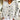 White women's blouse with a sheep print design, featuring a collar and long sleeves, made from lightweight textile material.