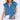 Sleeveless gray denim vest for women featuring frayed edges and front pockets, shown on a mannequin with a white T-shirt underneath.