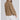 Women's tan cropped jacket featuring a stylish lightweight design, with a focus on the shoulder, neck, sleeve, and collar details, suitable for a fashionable fall fit.