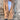 Tan suede blazer for women with a lightweight design, suitable for fall fashion. The jacket features a beige color, long sleeves, and a tailored fit at the waist.