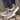 Women's turquoise slip-on shoes with a fur lining, shown on feet in an outdoor grassy setting, ideal for stylish winter wear.
