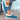 Women's turquoise slip-on shoes with fur lining, featuring a stylish winter design in shades of blue and black.