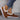 Women's turquoise slip-on shoes with fur lining, designed for winter; shown on a model's feet against a neutral background.