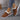 Women's turquoise slip-on shoes with fur lining, designed for stylish winter wear, shown in an indoor setting.