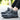 Women's black and grey waterproof insulated hiking boots with an anti-slip sole, designed for style and functionality in outdoor activities.