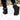 Women's grey waterproof insulated non-slip winter snow boots being worn, highlighting the footwear's design and coverage up to the knee, suitable for snowy conditions.