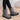 Women's waterproof insulated snow boots in electric blue, designed for non-slip traction and thermal durability, shown worn on a person's legs.