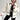 A stylish and cozy women's white faux fur winter jacket featuring a high collar, long sleeves, and a tailored waist, perfect for street wear.