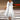 Women's white floral chiffon dress with lightweight summer jacket, featuring a flattering shoulder design, elegant neckline, and flowing sleeves, showcased on a fashion model. The dress has a defined waist, suitable for formal events and runway fashion.