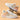 Women's stylish low-top white lace-up sneakers with a durable sole, showcasing a fashionable design ideal for walking and sportswear activities.