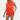 Women's white pleated high neck blouse with long sleeves paired with distressed denim shorts, featuring a stylish look with attention to shoulder and waist fit.