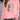 Women's white sweatshirt featuring a "Let It Be" feather print in a bohemian style, showing the shoulder and neck areas with hints of orange color, worn with jeans.
