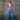 Women's wide-leg blue denim overalls featuring pockets, displayed with focus on the leg and waist areas.