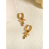 18K Gold Hoop Earrings with Pink Gemstone and Gold Leaf Charm by Ya-Chan.