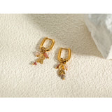 18K Gold Hoop Earrings with Pink Gemstone and Gold Leaf Charm - Ya-Chan featuring intricate gold detailing and a delicate pink gemstone charm.