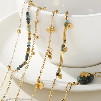 18K gold plated stainless steel charm bracelet with white accents from YA-CHAN Jewelry.