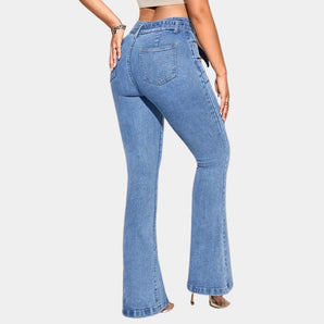 High-waisted flared bell bottom jeans in a vintage 70s style, showcasing a fitted waist and wide leg design that extends into a dramatic flare at the knee.