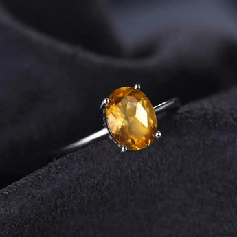 925 Sterling Silver Oval Citrine Ring with a vibrant yellow gemstone, perfect for November birthstone jewelry, shown in a close-up view highlighting its intricate design and sparkle.