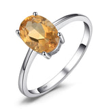 A 925 sterling silver ring featuring an oval citrine gemstone, suitable as November birthstone jewelry, size 7.