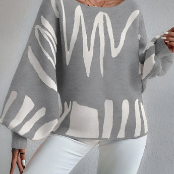 Abstract grey balloon sleeve sweater featuring a trendy design for women's fall knitwear, with focus on the puffed sleeves and neutral grey color.