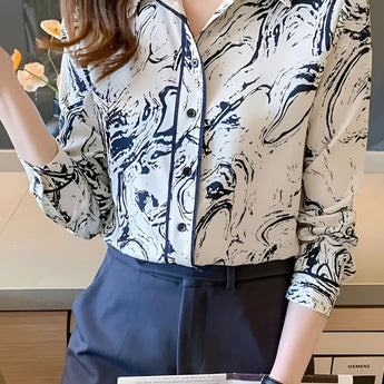 Abstract print beige and navy women's blouse with swirl pattern, styled as an office shirt, shown in blue color, size 2XL. The blouse features long sleeves and a classic collar, suitable for a fashionable and professional look.