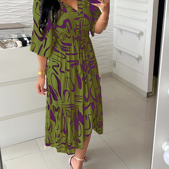 Abstract print V-neck summer dress with ruffle hem, plus size, in purple, featuring short sleeves and a fitted waist.