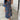 Abstract print V-neck summer dress featuring a ruffle hem, designed for plus size, in blue, with short sleeves and a flattering waistline.