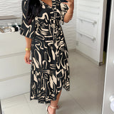 Abstract Print Plus Size V-Neck Summer Dress with Ruffle Hem in Nero1, featuring short sleeves and a flowing design for a stylish and comfortable fit.