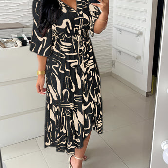 Abstract Print Plus Size V-Neck Summer Dress with Ruffle Hem in Nero1, featuring short sleeves and a flowing design for a stylish and comfortable fit.