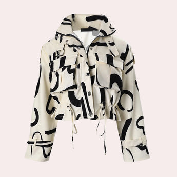 Abstract print women's cropped jacket in black and white with a drawstring waist, featuring a collar and long sleeves.
