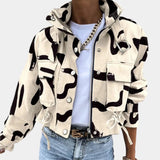 Black and white abstract print women's cropped jacket with a drawstring waist, featuring a collar and sleeves, displayed in apricot color and XL size.