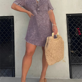 Acid wash denim mini dress in dark violet, featuring a collared neckline and short sleeves, styled in a trendy fashion.