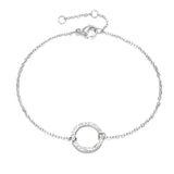 Adjustable silver bracelet with circular charm, minimalist and elegant design, made of natural silver material.