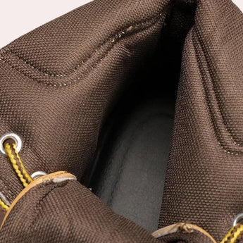 Men's waterproof tan leather high-top work boots, designed for durability and comfort, shown in an outdoor setting.