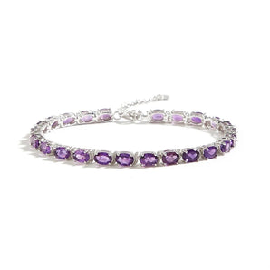 Sterling silver tennis bracelet featuring lavender amethyst gemstones, 22cm long, luxurious February birthstone jewelry.