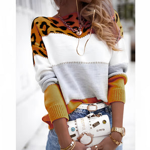 A trendy autumn knitwear sweater featuring a colorful animal print and color block design in shades of yellow and orange, available in size 3XL. The sweater has a crew neck and long sleeves, combining a modern style with classic knitwear comfort.