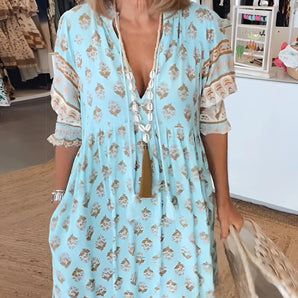 Light blue floral and lace boho V-neck tunic dress featuring long sleeves and a relaxed, flowy fit.